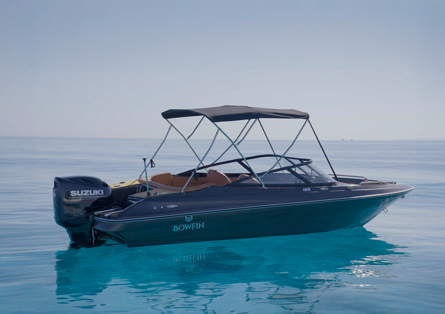 Bowfin 185 reflected in calm sea