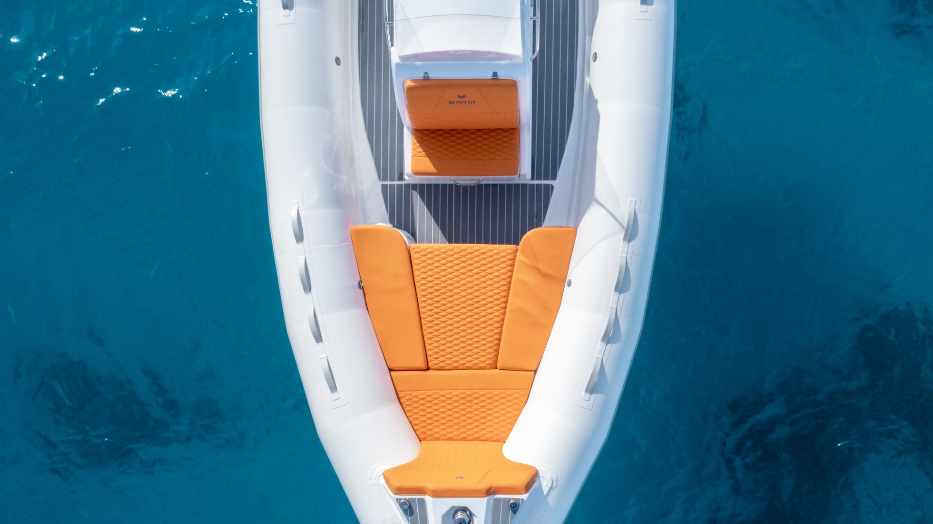 Top-down view of Bowfin RIB bow with orange upholstery