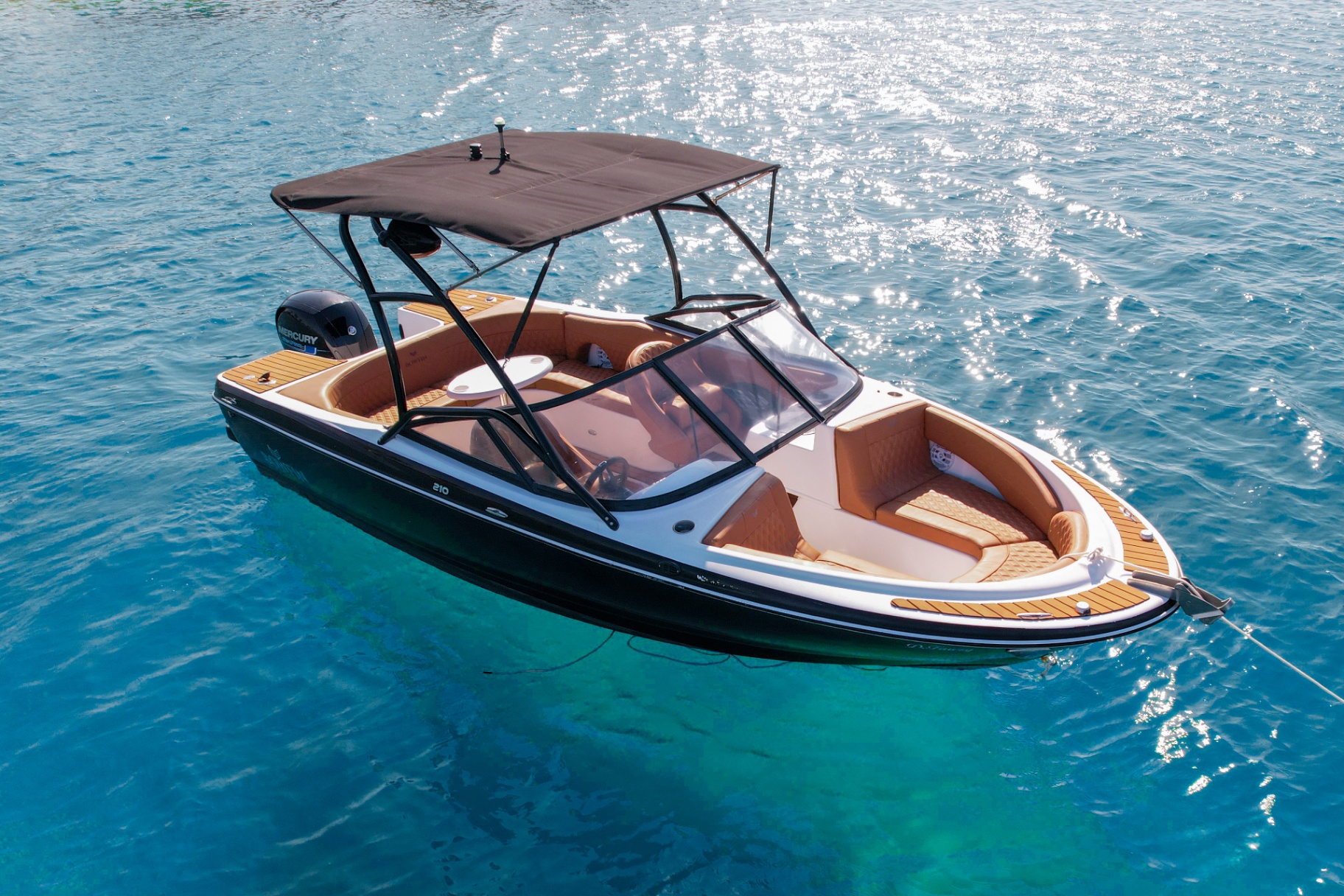 Bowfin 210 with tan interior on turquoise water